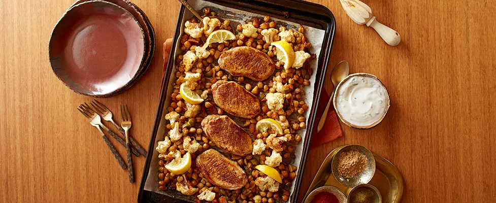 Chicken and chickpeas on a baking sheet