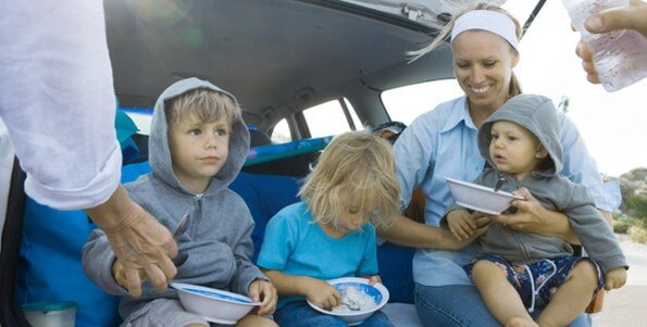family eating on road trip