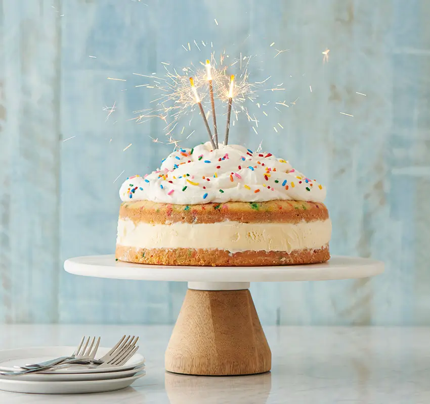 Celebration Cake Recipes - ice cream cake with sparklers on a cake stand