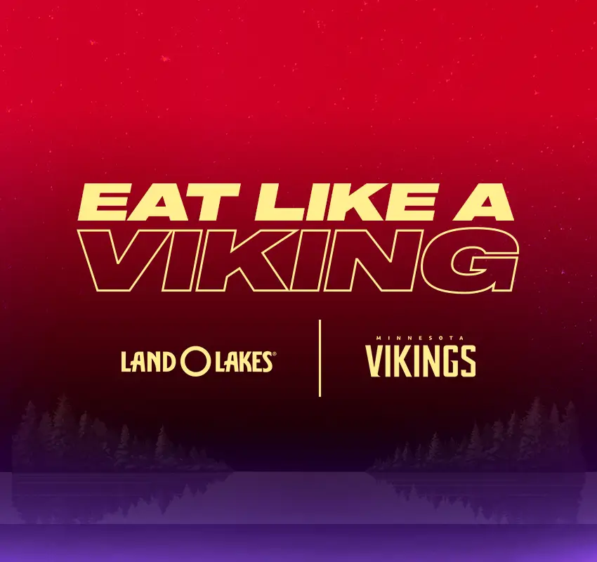 red on top, blending to black and then Viking purple near bottom - Eat Like a Viking in large capital letters, smaller font below reads Land O Lakes and Minnesota Vikings